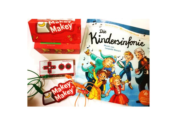 Bild von einem Makey Makey-Set und einem Bilderbuch